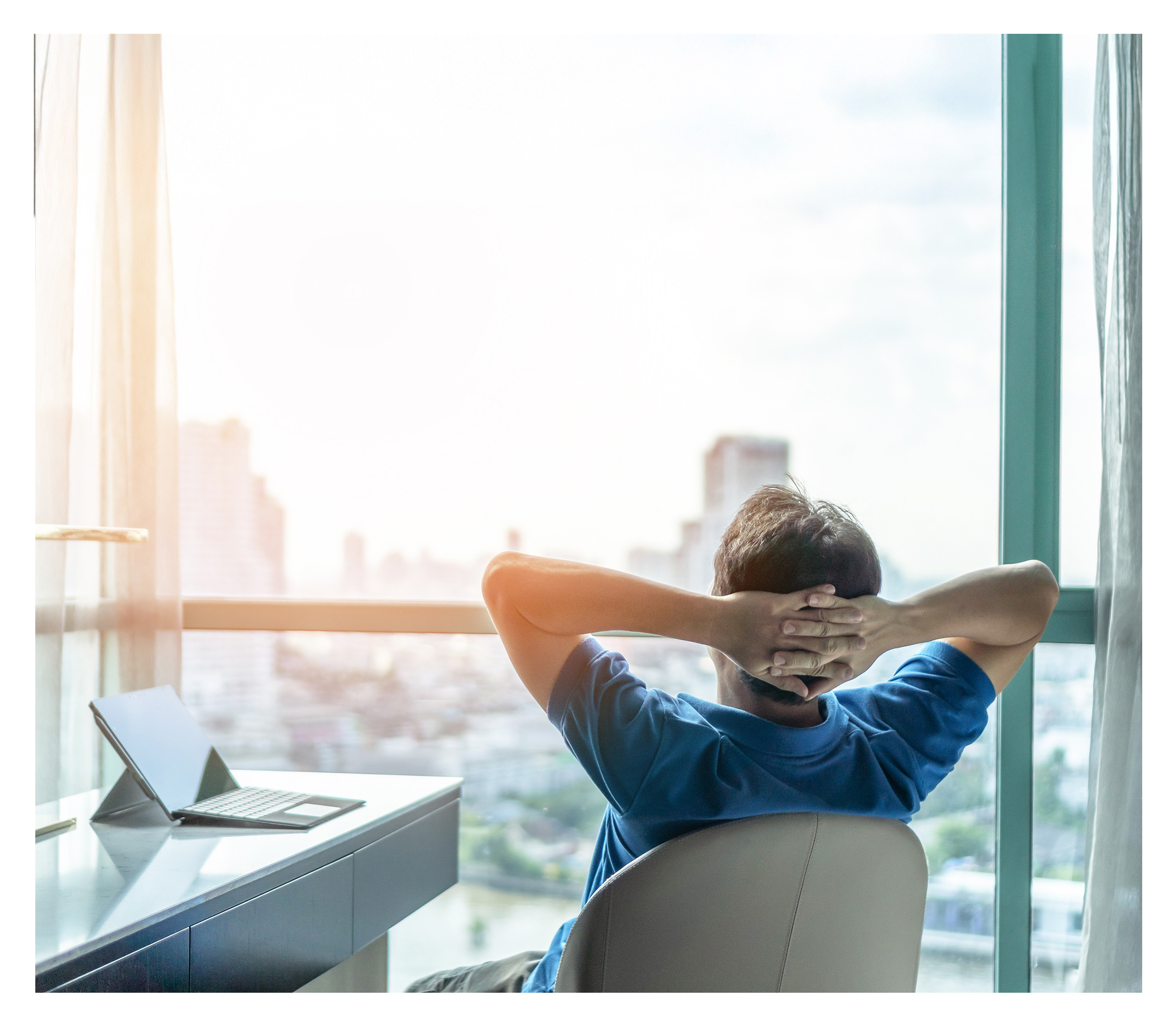 Building manager relaxed at desk, confident in system performance